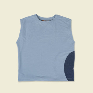 Sport tank laydown in light blue with a dark blue circle design made of a polyester and tencel