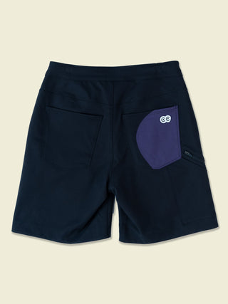 Laydown of the black shorts with eyes logo peeking
