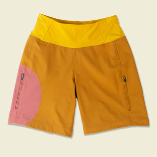 Buckthorn brown shorts with Aragon pink circular color block and bright yellow yoga waist band laydown
