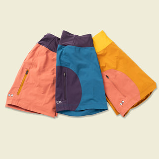 Full collection of Sun Dog shorts in Pink, blue, and buckthron brown