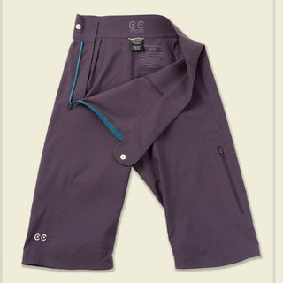 Laydown of the purple Marylin shorts showing the side zip enters and clean finished interior for low bulk while mountain biking