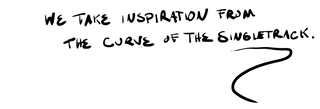 Black handwritten text reading 'WE TAKE INSPIRATION FROM THE CURVE OF THE SINGLETRACK.' with a large abstract scribble mark below.