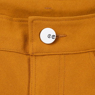 Closeup of the bright white center front button with black CC eyes logo