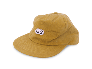 relaxed washed yellow hat with brim and white black eyes outline double C woven patch logo