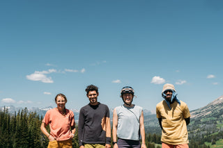 Hilary, Pasha, Hannah, and Chima all stand as happy bikers out in the Gallatin Mountains of Montana